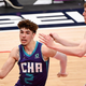LaMelo Ball of the Charlotte Hornets looks to shoot in front of Davis Bertans of the Washington Wizards during the second half at Capital One Arena on May 16, 2021 in Washington, DC.